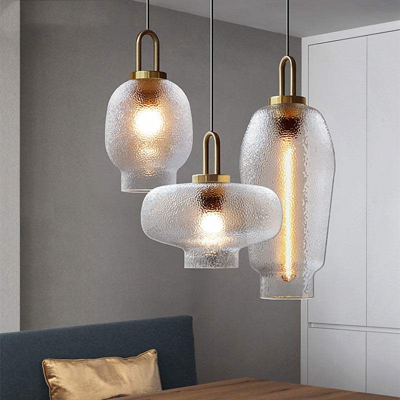 Minimalist dining table with modern glass chandelier in simple style